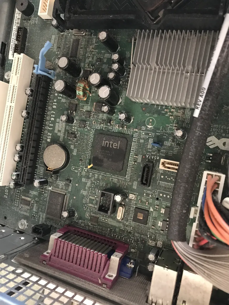 Motherboard and expansion slots inside an older Dell OptiPlex 755 desktop.