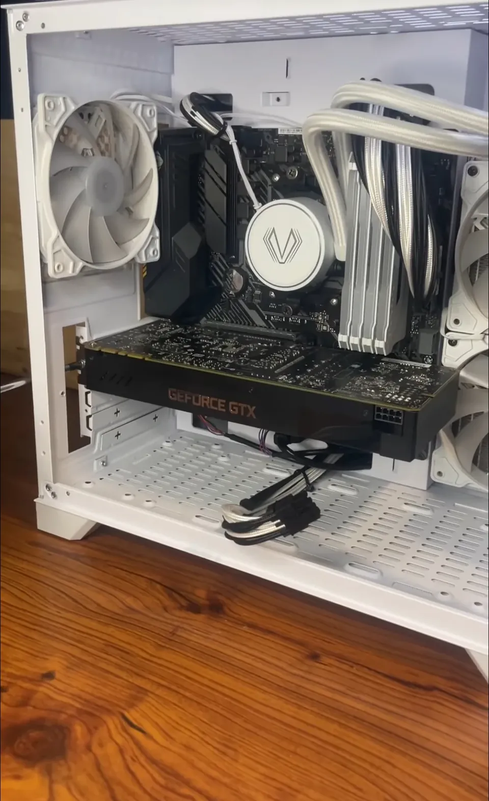 HP GTX 1070 graphics card inside an open white desktop case, with its auxiliary power socket not yet connected.