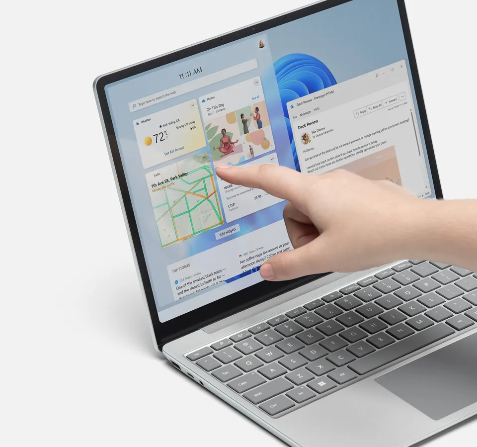 Microsoft promotional photo of a Surface laptop in use